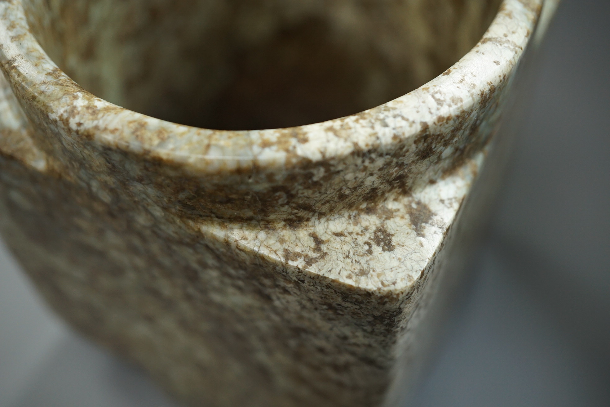 Four Chinese archaistic jade or hardstone cong